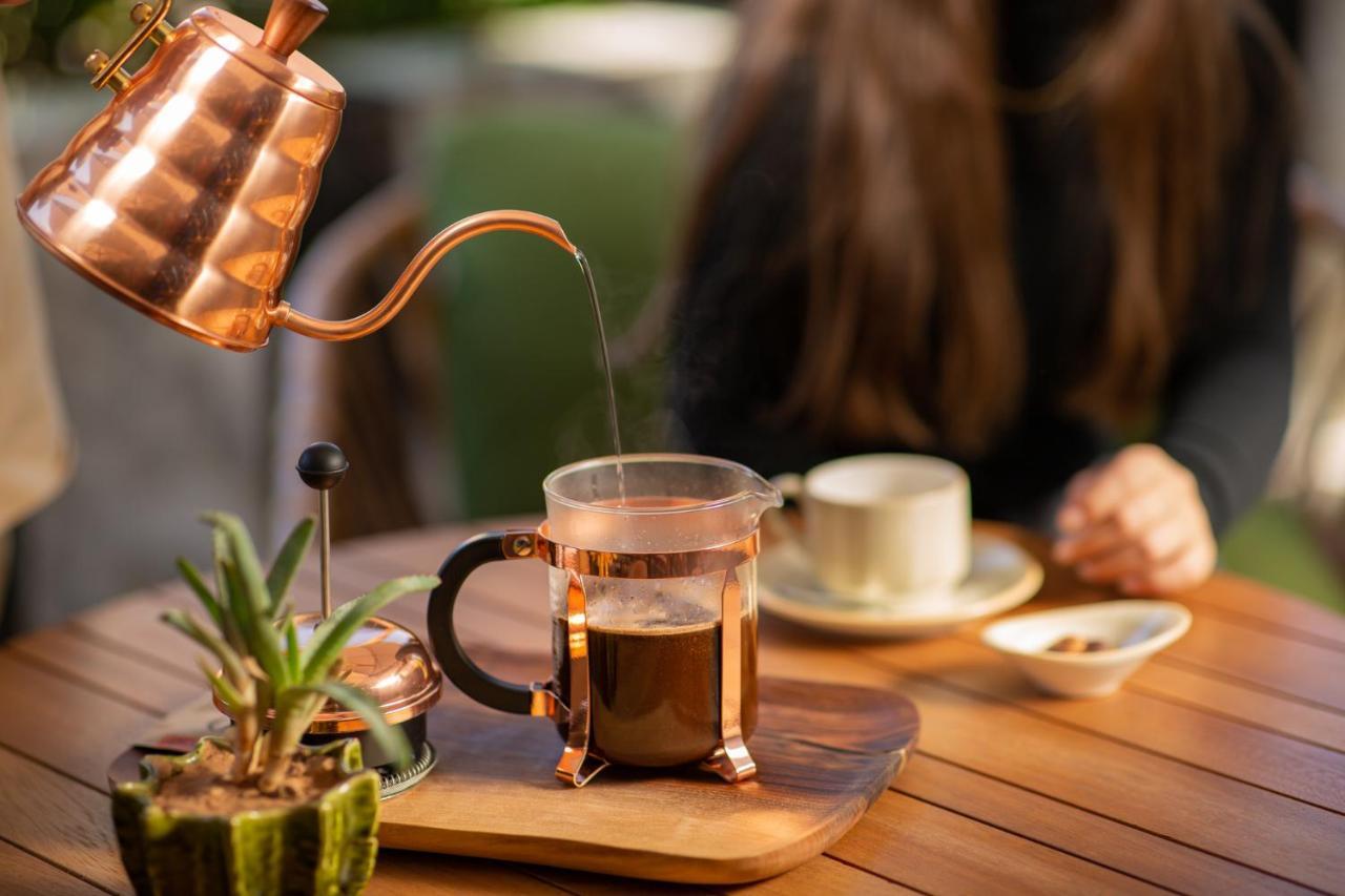 Hotel Jadali & Spa Marrakesh Exteriör bild A copper kettle and a glass cup