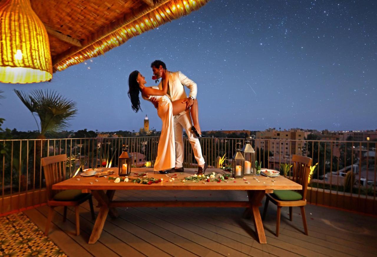 Hotel Jadali & Spa Marrakesh Exteriör bild A couple dancing on a rooftop